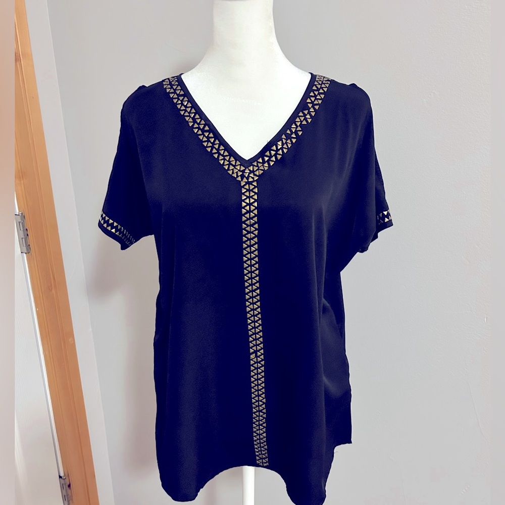 Miami women’s black shoulder cutout shirt with gold detail. Size SM.